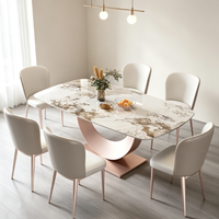 Table basse rectangulaire moderne et minimaliste, avec plateau en marbre et base en métal, idéale pour le salon.