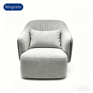 Sillón moderno tapizado en tela gris con paneles laterales en relieve, adecuado para salas de estar y comedores - Product Image 6