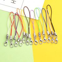 Vente en gros de sangles de téléphone colorées en forme de griffe de homard, pendentifs pour téléphone, accessoires de bijouterie et sangles de suspension