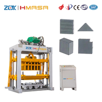 Machine automatique de production de blocs creux en béton QTJ4-40 à commande PLC, pression hydraulique, moteur, petite machine de production de briques en ciment