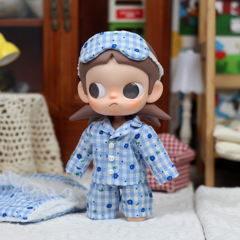 Blue floral pajamas, pajama bottoms, and eye mask