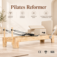Reformer Pilates en chêne avec rail en acier inoxydable et roues en PU ultra-silencieuses pour l'entraînement de flexibilité en studio et à domicile