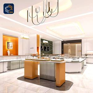 Comptoir d'exposition moderne pour bijouterie avec vitrine en verre et design d'armoire blanc et orange - Product Image 1