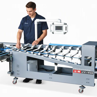 L'encolpeuse-plieuse JY-450, accompagnée d'un empileur, complète votre ligne de post-pressage pour cartons rigides et ondulés, empileur automatique de boîtes