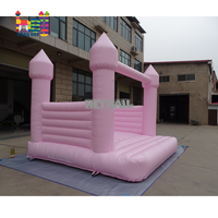 Château gonflable rose pâle macaron pour enfants et adultes, idéal pour la location lors de mariages et fêtes