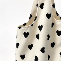 Sac fourre-tout en toile blanche avec imprimé cœur noir, sac à main décontracté à porter à l'épaule pour femmes, pour le shopping, les voyages et l'usage quotidien