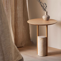 Table basse ronde de style italien moderne avec base en travertin pour appartement ou bureau