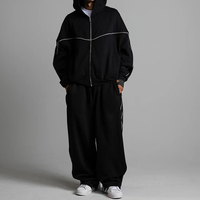 Ensemble de survêtement oversize personnalisé avec logo, 2 pièces : sweat à capuche zippé et pantalon de survêtement à jambes larges, passepoil blanc, épaules tombantes, style streetwear, OEM