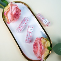 Tube de brillant à lèvres en gros Mini bouteille de rouge à lèvres Matériau ABS avec emballage cosmétique au design coeur rose