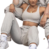 Ensemble de sport pour femme, nouvelle tendance, brodé, motif uni, crop top et pantalon long, longueur courte, pour le yoga et le fitness, en tissu éponge