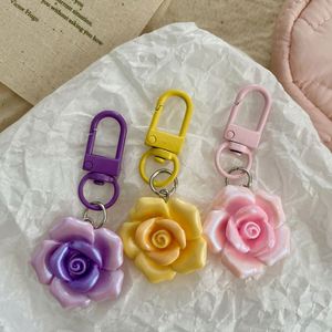 Coque de téléphone légère et étanche en résine avec fleurs de camélia colorées et breloques lumineuses - Product Image 4