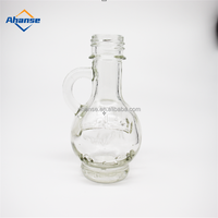 Tersedia 30Ml 1Oz Botol Kaca Logo Ukir Mini Botol Kaca Minyak Zaitun Kustom dengan Pegangan untuk Minyak