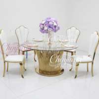 Fabrication en usine de chaises et tables de luxe en acier inoxydable de qualité supérieure, élégantes, blanches et dorées pour les événements de mariage
