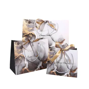 Commercio all'ingrosso moda ambientale nastro dorato matrimonio regalo di compleanno sacchetto di fiocco di carta marmorizzazione Shopping borsa