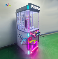 Vente en gros Machine de jeu avec boîte aveugle à pièces Machine de cadeau Push-Push de jeu de marbre