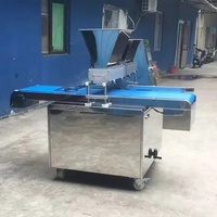 Machine à garnir les snacks, pains, gâteaux et croissants de crème, pour la production de produits à garniture crémeuse