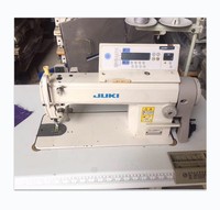 Machine à coudre plate industrielle Juki DDL-5550N-7 d'occasion, à une aiguille, informatisée, avec coupe-fil automatique et moteur servo