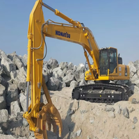 Excavatrice sur chenilles Komatsu PC1250HD de grande taille avec un puissant moteur de 775 ch. Les composants principaux incluent le moteur, la boîte de vitesses, la pompe à engrenages, le roulement, le PLC.