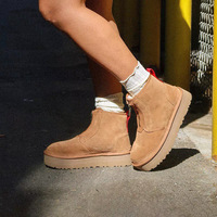 Nouvelles bottes d'hiver pour femmes en cuir véritable à semelle épaisse, style personnalisé, avec fermeture éclair avant, plateforme, semelle plate, tige courte et garniture en fourrure