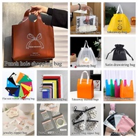 Sacs shopping en papier holographique métallisé scintillant avec poignée en ruban noir pour les boutiques de vêtements de marque