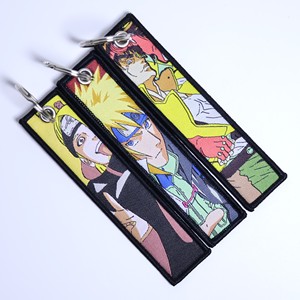 Vente en gros de porte-clés en tissu brodé de style japonais classique, porte-clés de poche avec motif de monstres de poche, porte-clés en tissu anime - Product Image 1