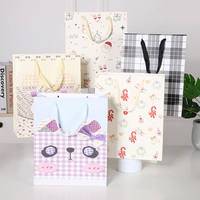 Customized Wholesale Classic Recycled Paperboard Craft Gift Packaging Bags Cute Animal Christmas Pattern Offset Printed Ribbon