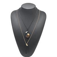 Collier tendance minimaliste avec chaîne en corde à pétales, grand collier pour femme avec pendentif goutte d'eau et breloque en bois