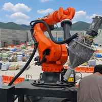 Bras robotique manipulateur KUKA, application d'impression 3D robotique, imprimé avec des matériaux spécialisés, industrie de la construction, charge utile de 210 kg