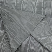 Nouveau design Tissu polyester moiré en stock Tissu fini effet moiré Tissu gaufré à effet visuel 3D pour robes et sacs