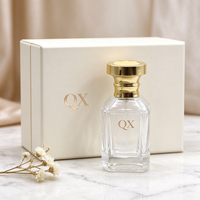 Vente en gros de flacons de parfum en verre transparent blanc cristal de 30 ml avec bouchon en métal doré brillant pour emballages de parfums de luxe