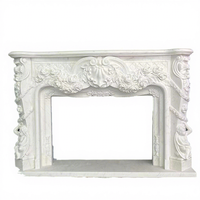 Cheminée décorative d'intérieur en marbre blanc de style européen et français avec sculptures rondes faites à la main