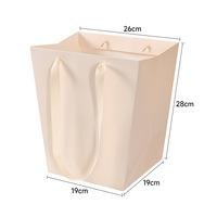 Vente en gros de sacs d'emballage pour bouquet de haute qualité Sacs en papier trapézoïdaux pour cadeau de transport de roses Boîtes cadeaux avec poignées Bouquets