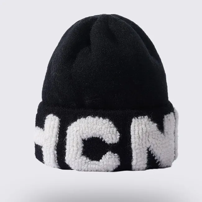 female autumn and winter new wool knitted hat Korean version versatile pile hat cold proof and warm big letter Beanie Hat