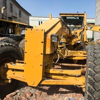 Niveleuse à moteur CAT 14H d'occasion, moteur CAT 3306 d'origine, stable et puissant, pour la construction routière, le nivellement des terres, les projets agricoles et routiers.