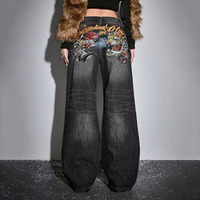 Jean en denim American High Street Tiger Rose à broderies lourdes, effet usé et craquelé, noir-gris, coupe ample et évasée