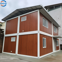 Maison conteneur préfabriquée modulaire blanche WinFair, duplex à deux niveaux avec toilettes, en vente au Ghana pour habitation