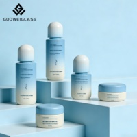 Set Botol Kosmetik Kaca Putih Buram Kustom Pabrik untuk Krim Wajah Kemasan Perawatan Kulit Kosong Pompa Losion Sablon Sutra