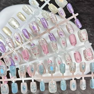 30 قطعة من الأظافر الصناعية القصيرة الملونة بتصميم نجمة وفيونكة وقلب، مجموعة أظافر اصطناعية سهلة التركيب - Product Image 1