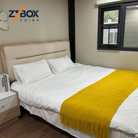 ZYBOX Conteneur extensible en forme de L de 30 pieds et 40 pieds, maison extensible, cabane modulaire préfabriquée en grain de teck, retraite de glamping en plein air