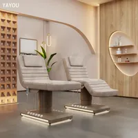 Lit de massage électrique à 3 moteurs avec base couleur bois et commande au pied pour salon de beauté