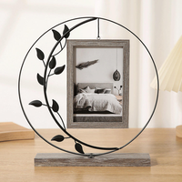 Cadre photo en cercle de fer en gros, base en bois avec feuilles noires, décoration bohème pour la maison, MOQ flexible, directement de l'usine