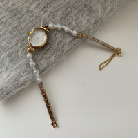 Montre française à petit cadran elliptique avec chaîne en perles naturelles, montre d'affaires, montre tendance pour femmes