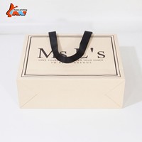 Sac de shopping en papier ivoire de luxe avec logo personnalisé, poignée en ruban noir, emballage cadeau pour boutique, vente en gros