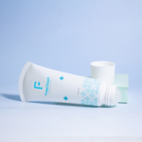 Tube en plastique souple pour les soins de la peau avec tête de massage à bille roulante