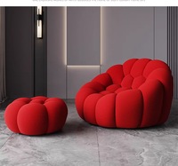 Fauteuil individuel de relaxation Roche Bobois Bubble Comfort, design moderne et luxueux, avec accoudoirs rouges, pour salon