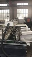 Machine d'assemblage et de pressage automatique à grande vitesse pour carton ondulé