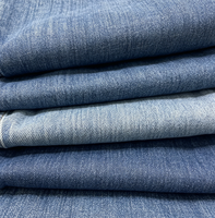 Tissu denim tissé à effet flammé pour vêtements féminins, chemises, jupes et pantalons en coton uni