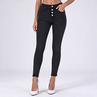 Jean skinny noir moulant pour femme, taille haute, en denim effiloché, idéal pour les sorties hivernales élégantes