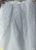 Robe de mariée convertible 2-en-1 avec illusion de perles, manches longues, corsage plissé, jupe de bal détachable et perles scintillantes