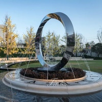 Fontaine d'eau sculpturale en acier inoxydable poli miroir, soudée sur mesure, grand cercle, art métallique pour jardin extérieur